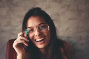 photo of smiling woman wearing eyeglasses