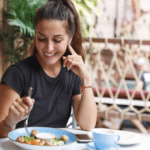 woman eating at restaurant table healthy food