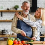 A couple preparing foods that help with chronic dry eye