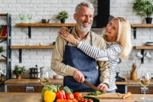 A couple preparing foods that help with chronic dry eye