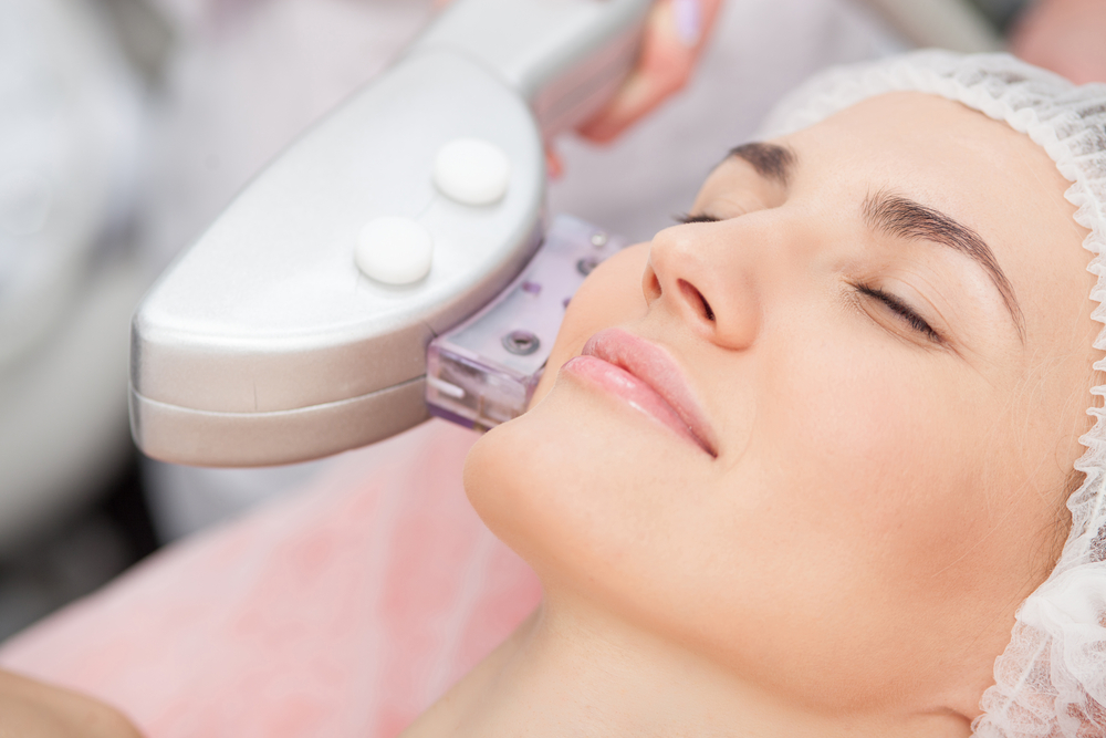 Close-up of a woman getting Lumenis M22 skin resurfacing treatment for toned, even skin.